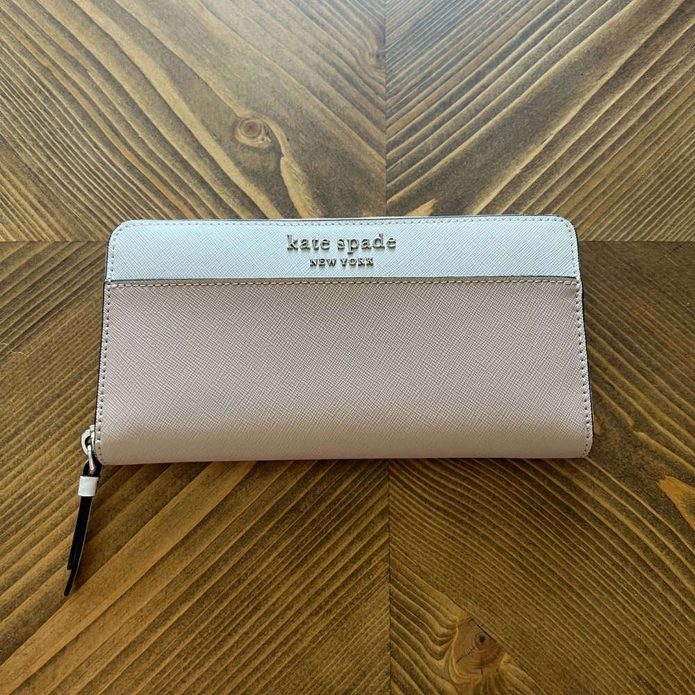 Small and large kate spade wallets.
